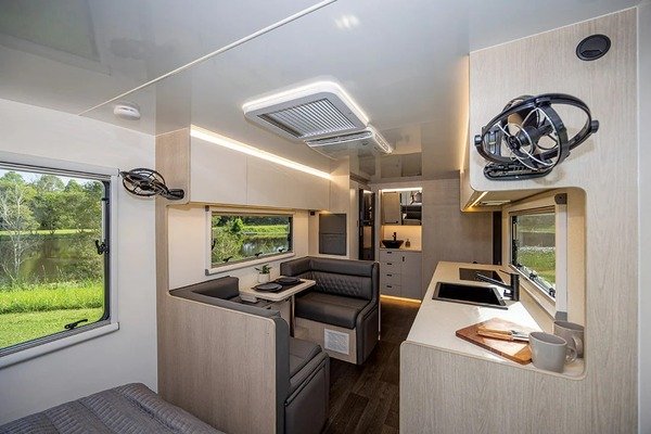 Interior space of caravan with effective air circulation from energy efficient air conditioning unit

